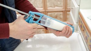 Caulking a sink